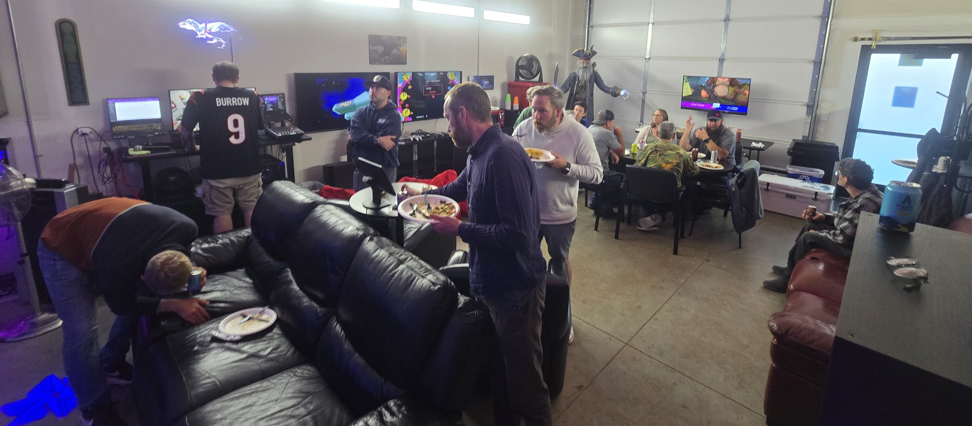 Guests socializing and eating at a corporate VR event at Epic Adventures in Vancouver WA